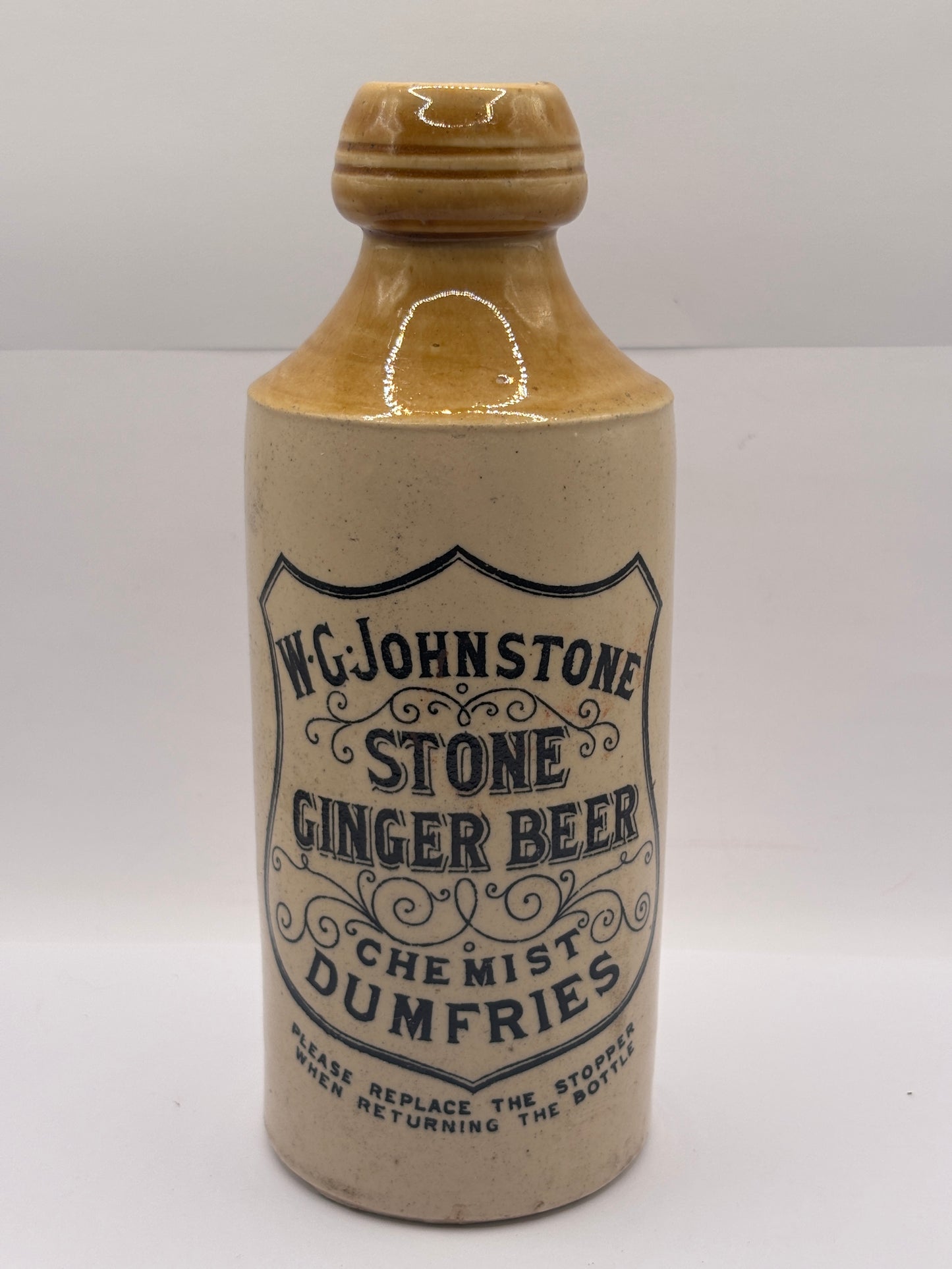Old stoneware ginger beer bottle, W.G Johnstone chemists Dumfries