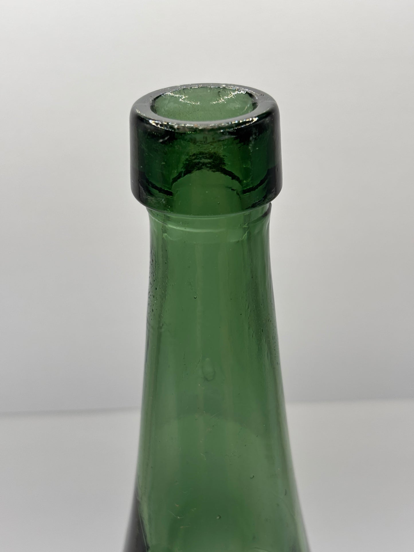 Old large dark green bottle