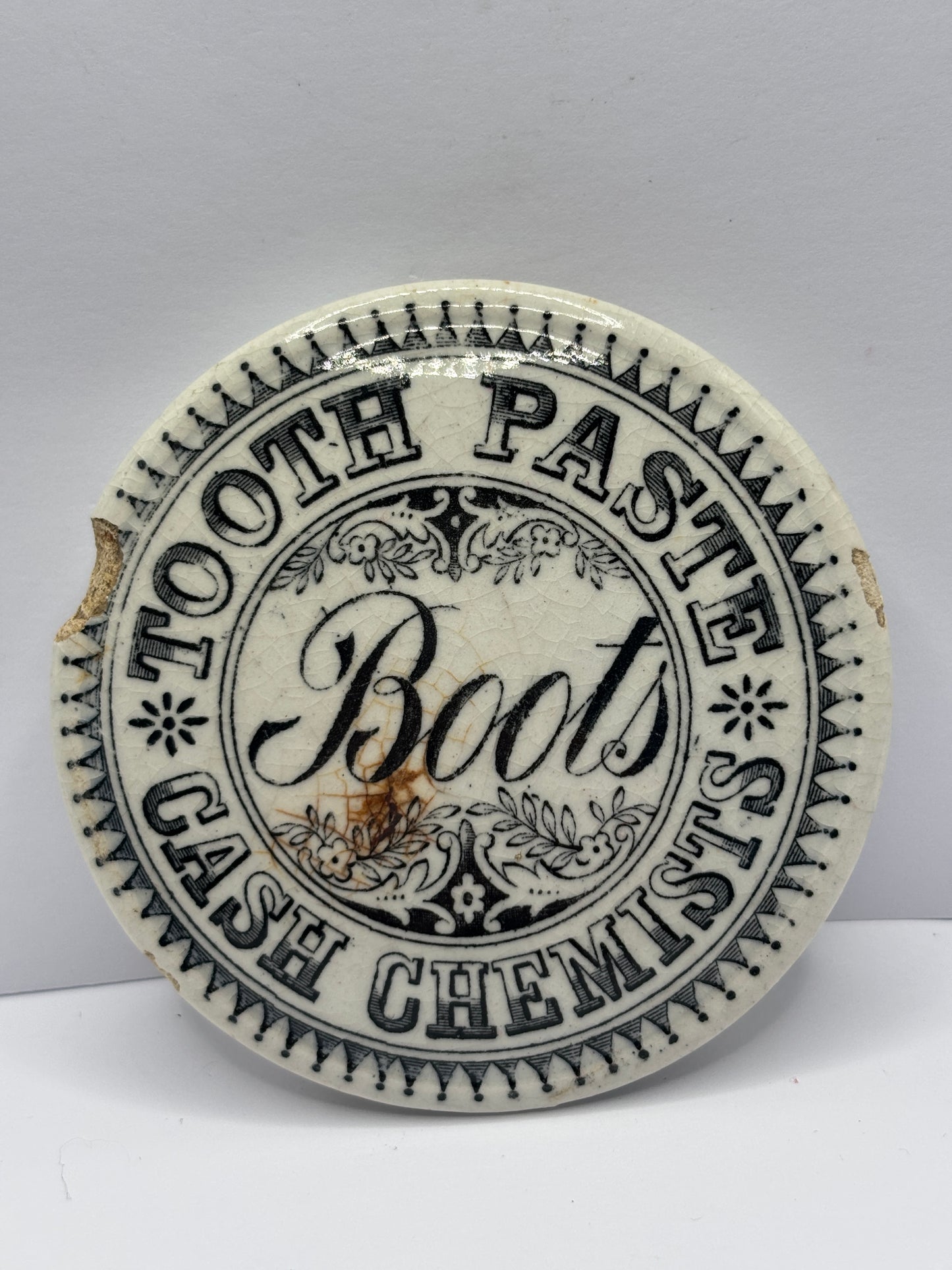 Old advertising lid, Boots cash chemist toothpaste lid. Damaged