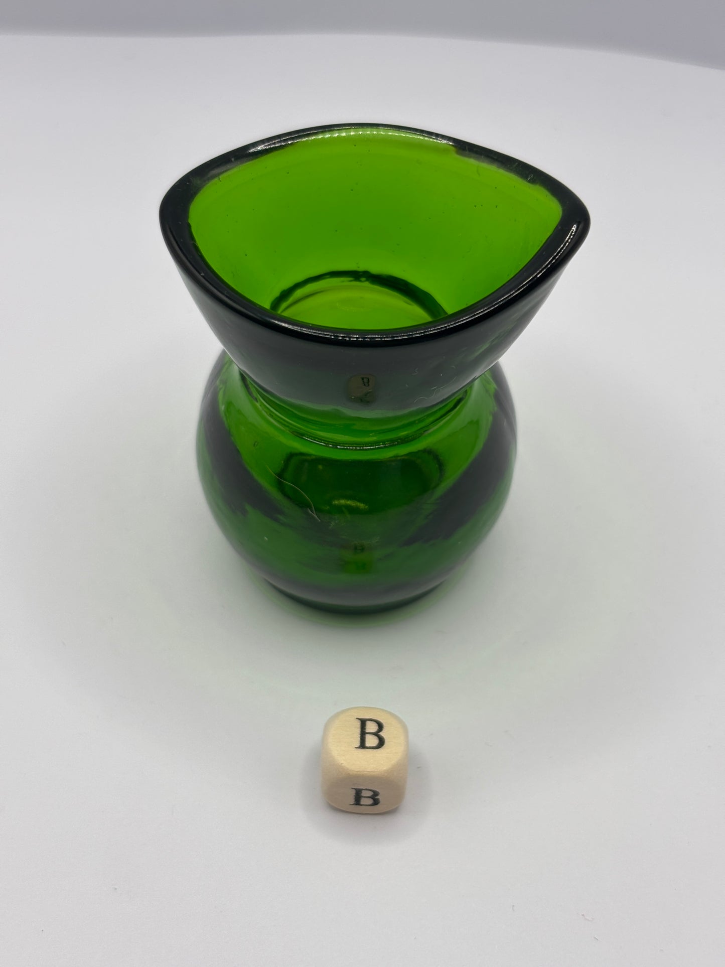 Old green glass eye bath (B)