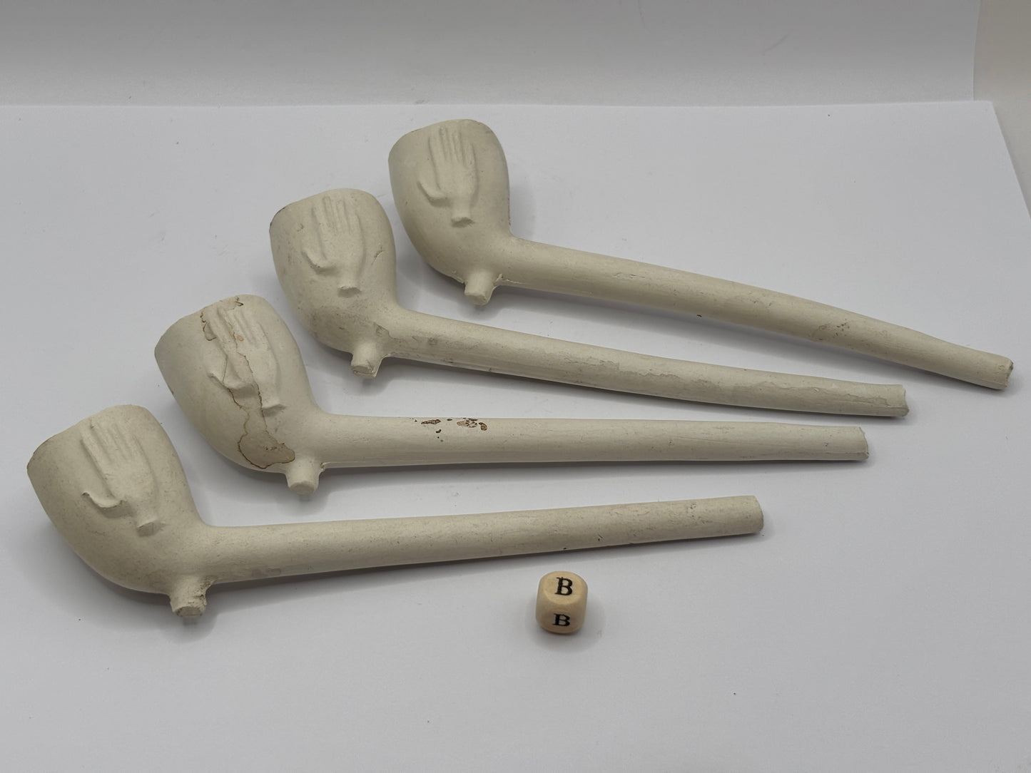 5 clay pipes (B)