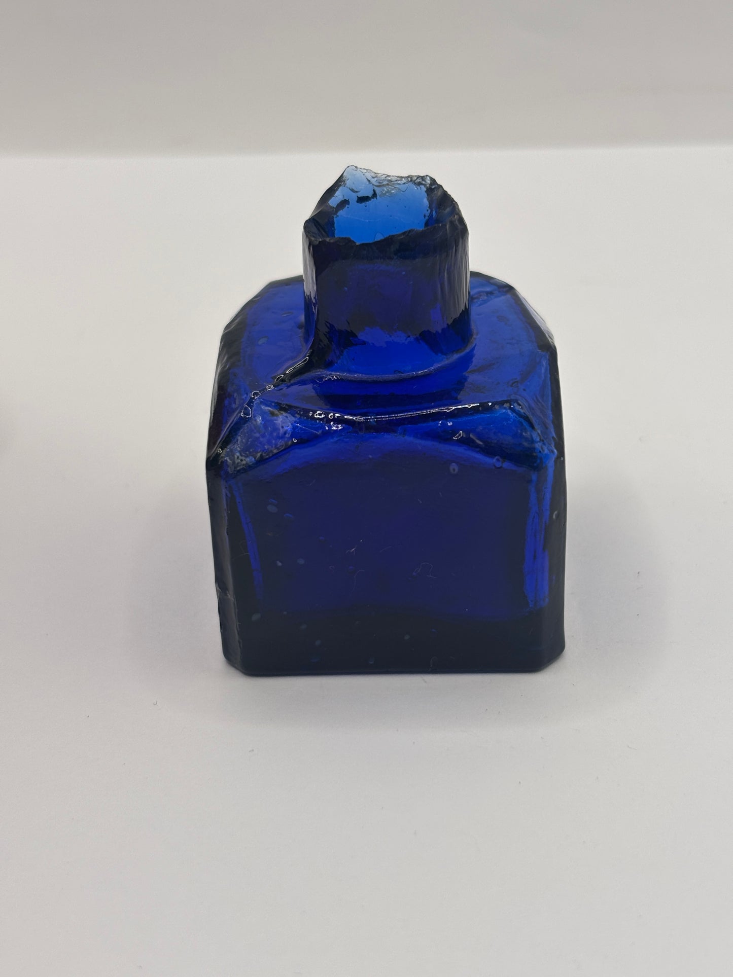 Old cobalt blue glass inkwell, ink bottle