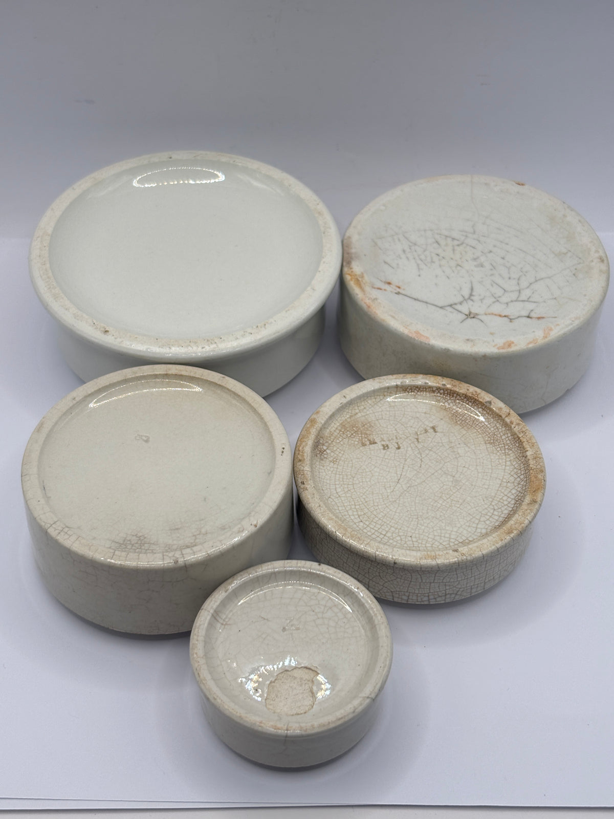 5 old stoneware pot lid bases, stackers (a)