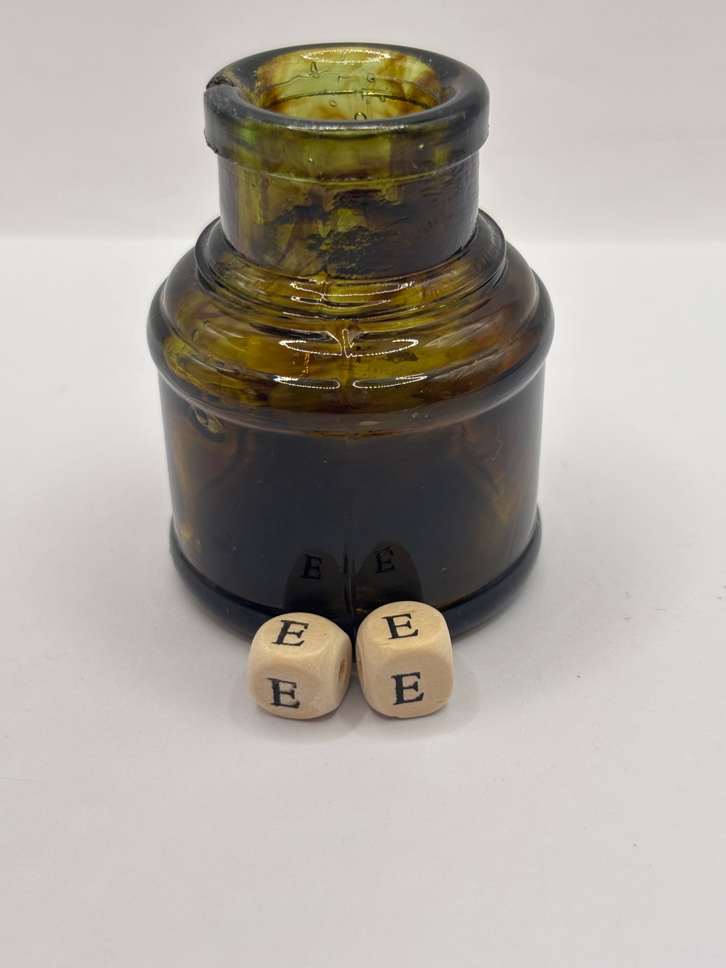 Old dark amber inkwell, ink bottle. Swirly (ee)