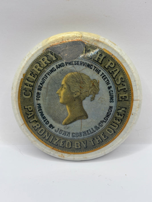 Old advertising lid, cherry tooth paste. Damaged/repaired