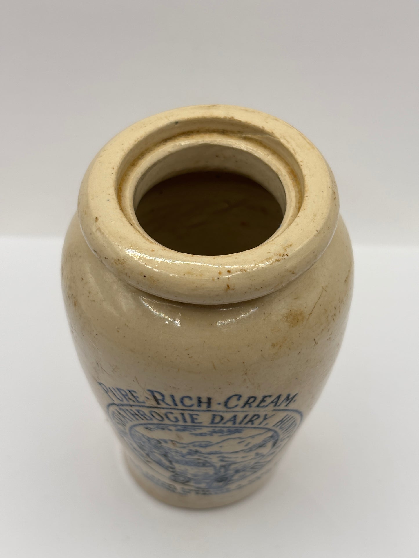Old stoneware advertising cream pot, Strathbogie Dairy, pure rich cream. Blue print. Milk maid, cow