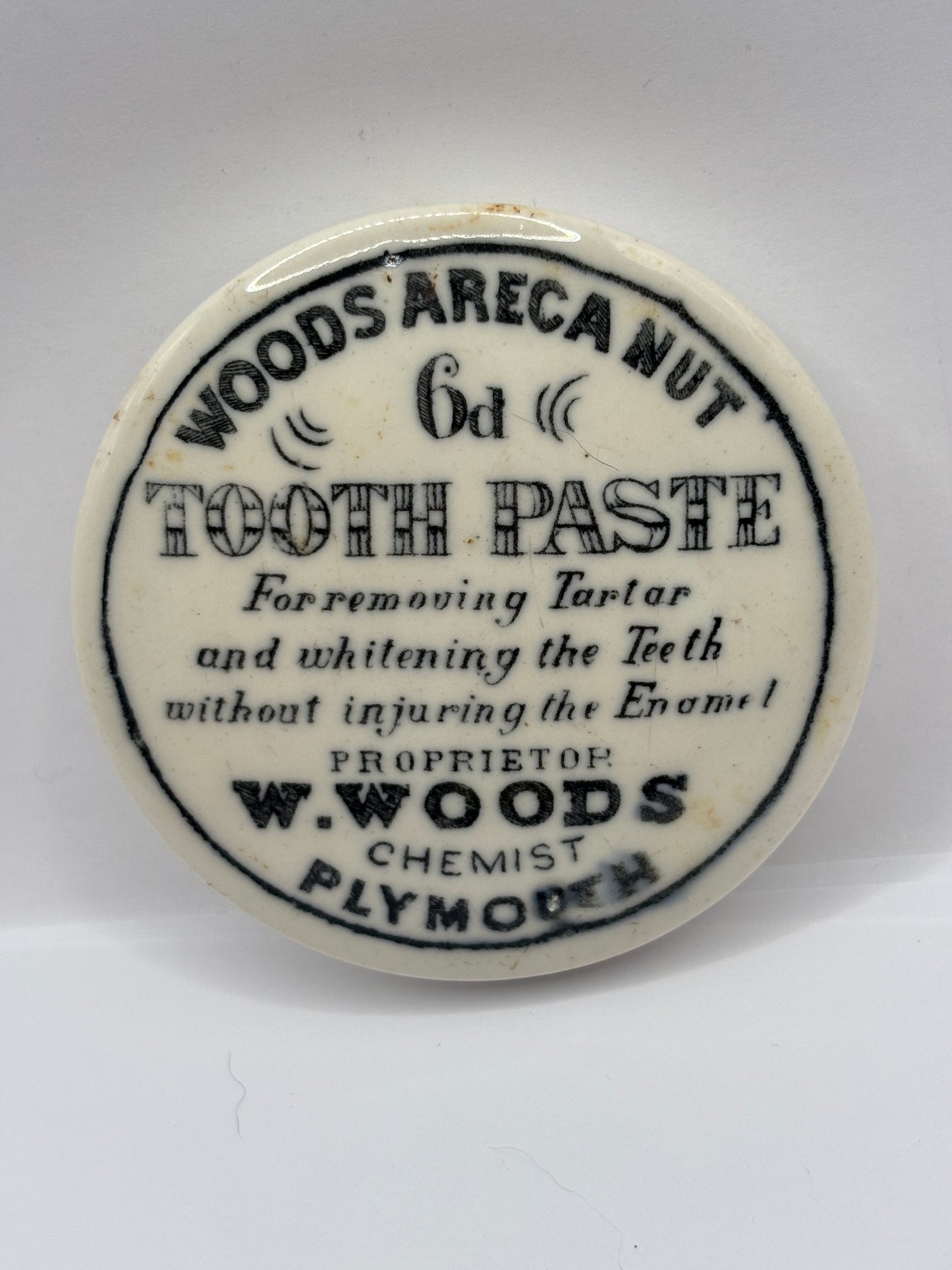 old advertising lid, Woods areca nut toothpaste