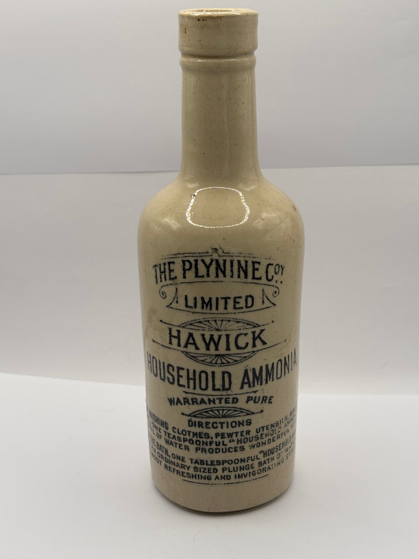 Old advertising stoneware bottle, Plynine household ammonia. Small size 21.5cms