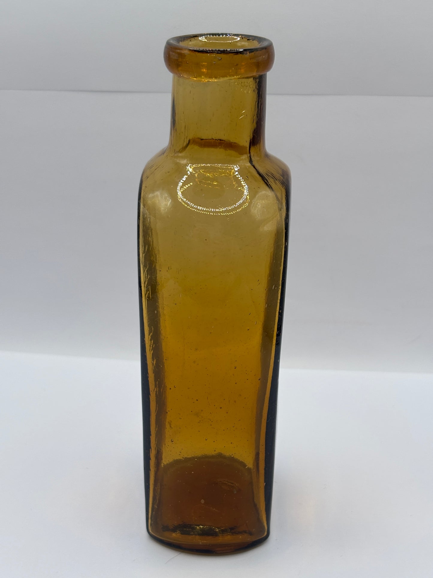 Old amber glass advertising chemist bottle, The Maltine manufacturing company