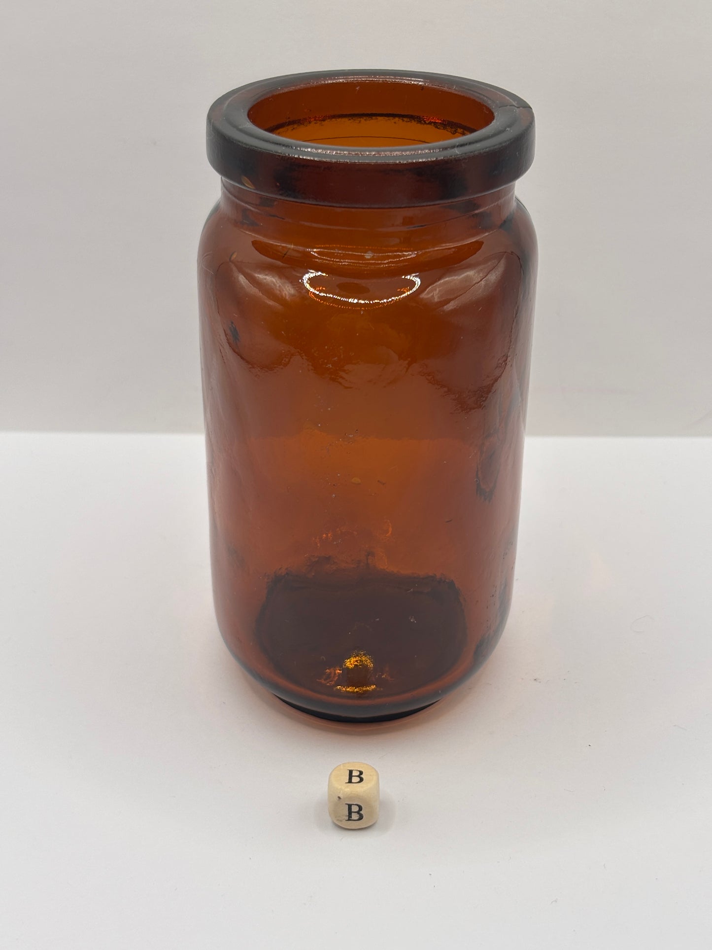 Old amber glass jar (B)