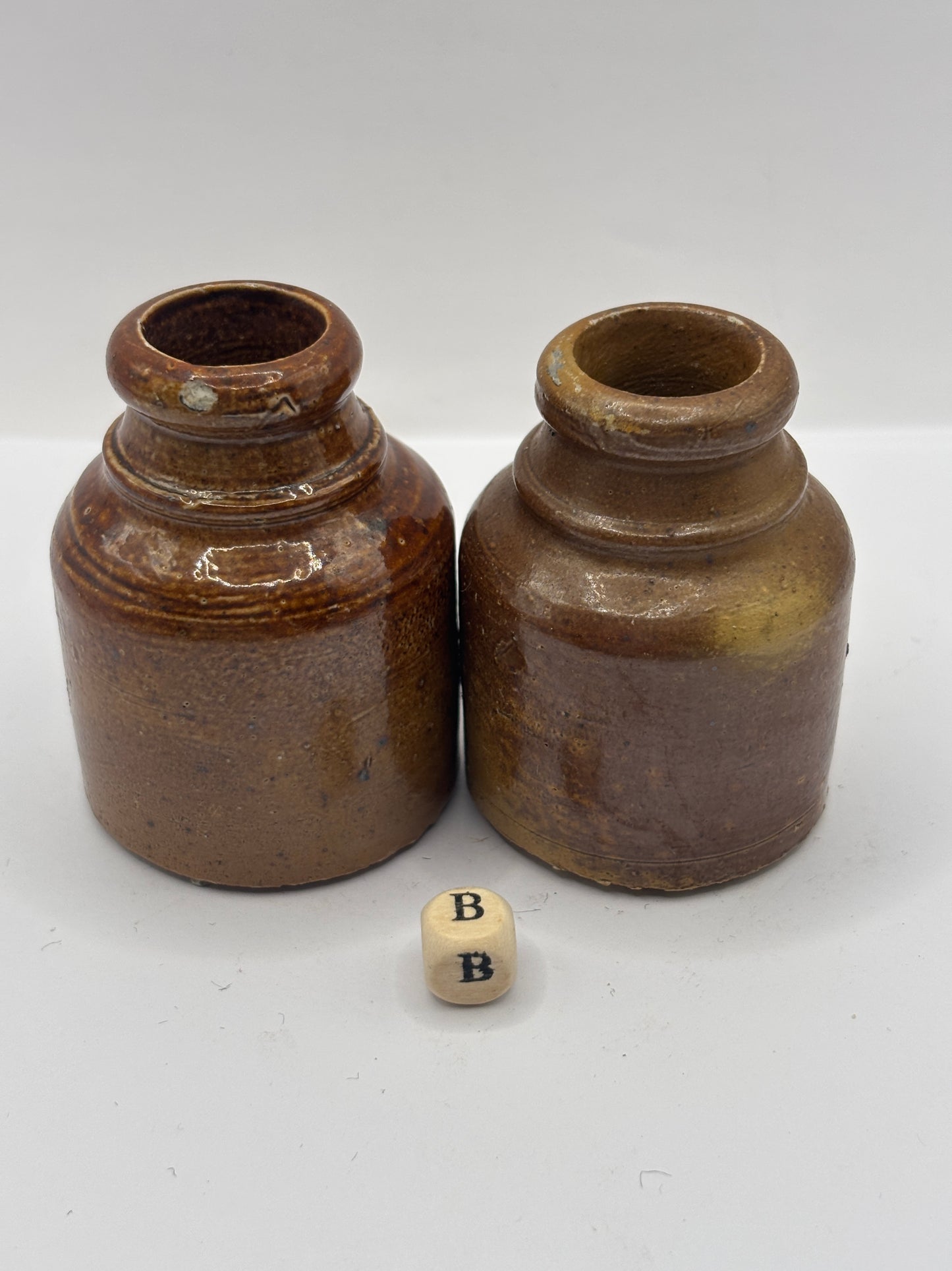 2 brown stoneware inkwells, ink bottles (B)