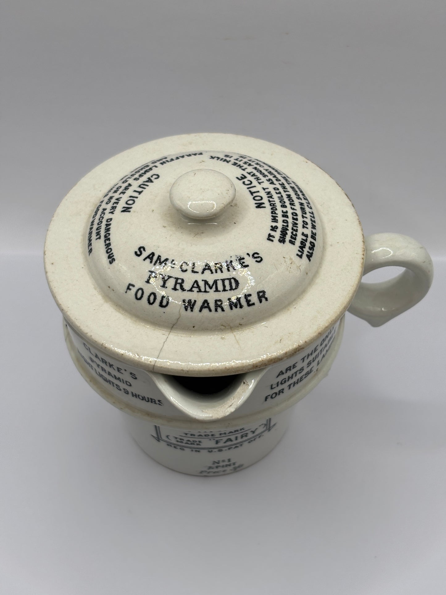 Old stoneware advertising food warmer. Clarkes Pyramid food warmer. Damaged/repaired