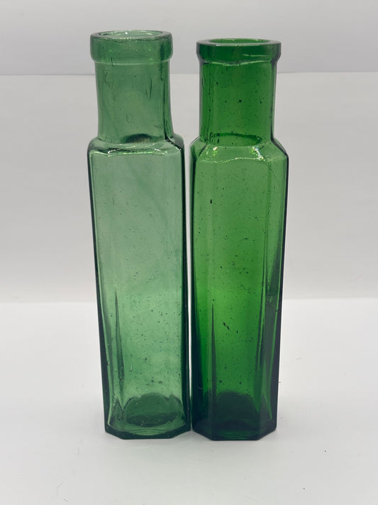 2 old green glass bottles