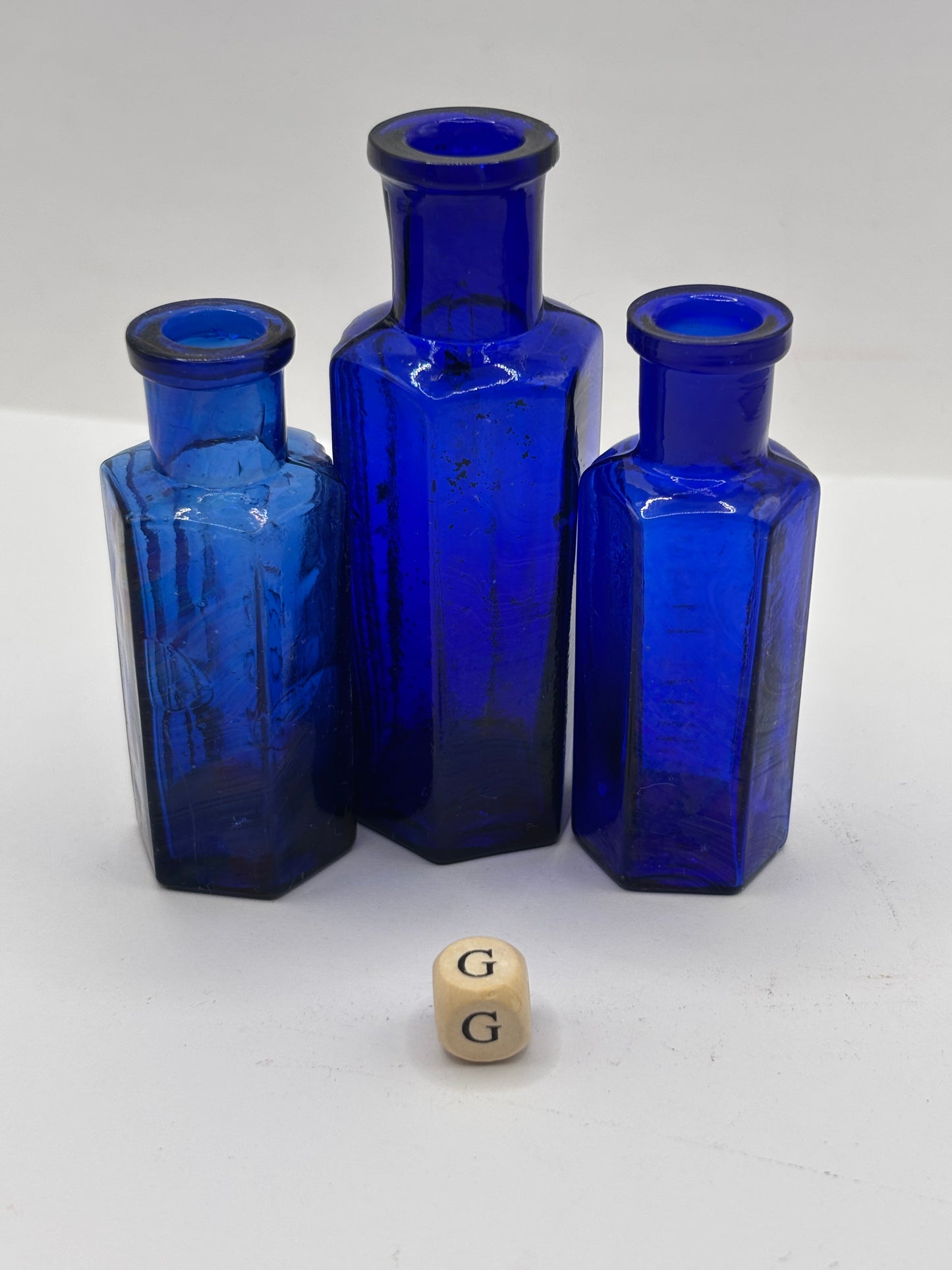 3 old blue glass poison bottles