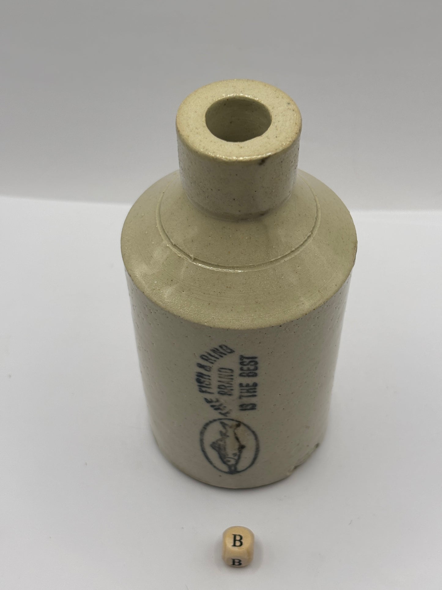 Old stoneware Fish & Ring brand advertising bottle (B)