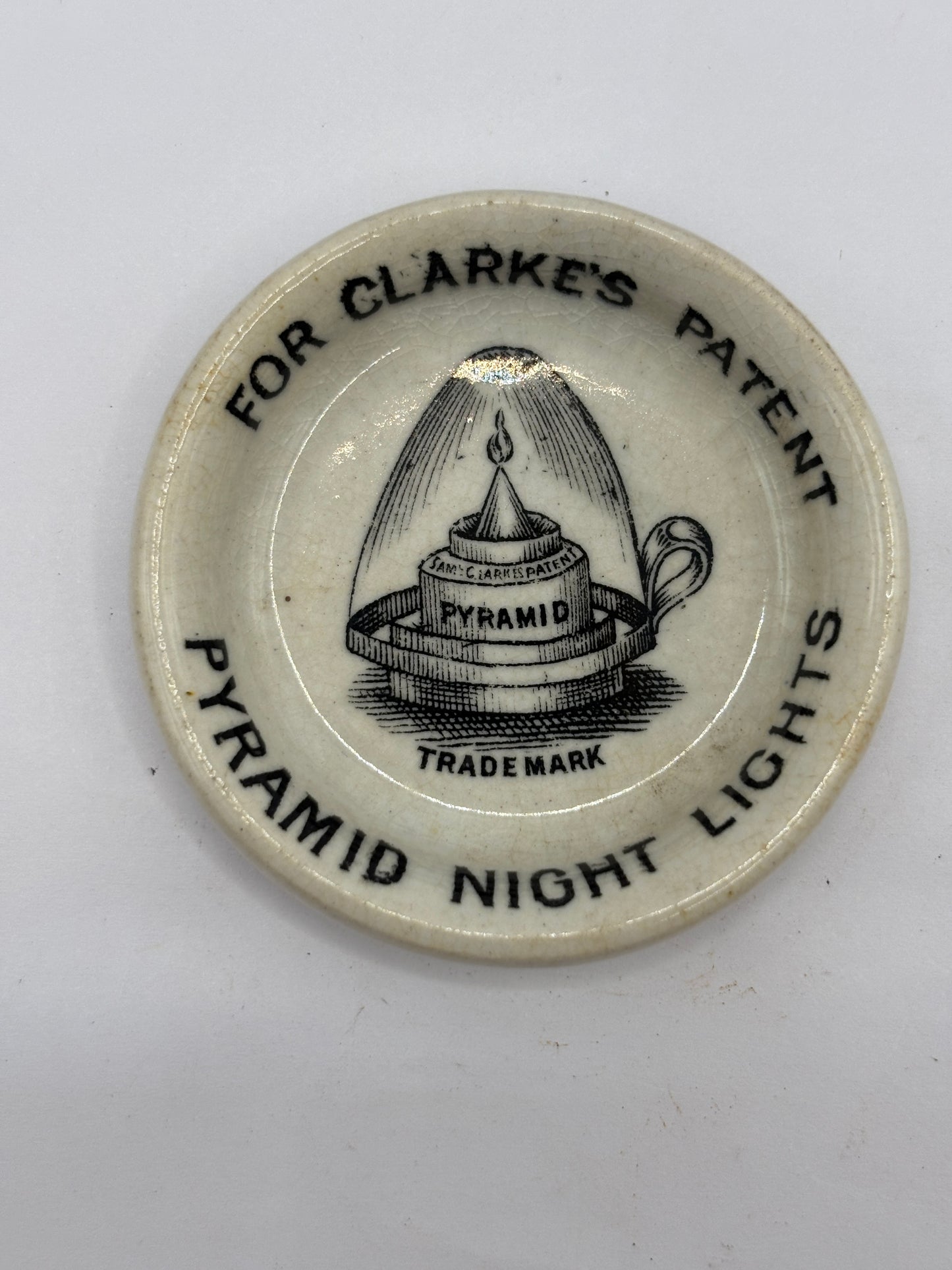 Old small advertising plate, Clarkes patent pyramid night lights