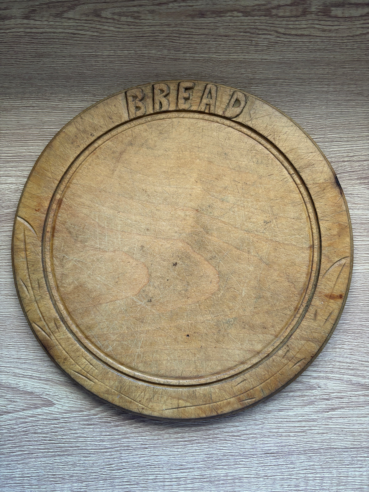 Old wooden carved bread board