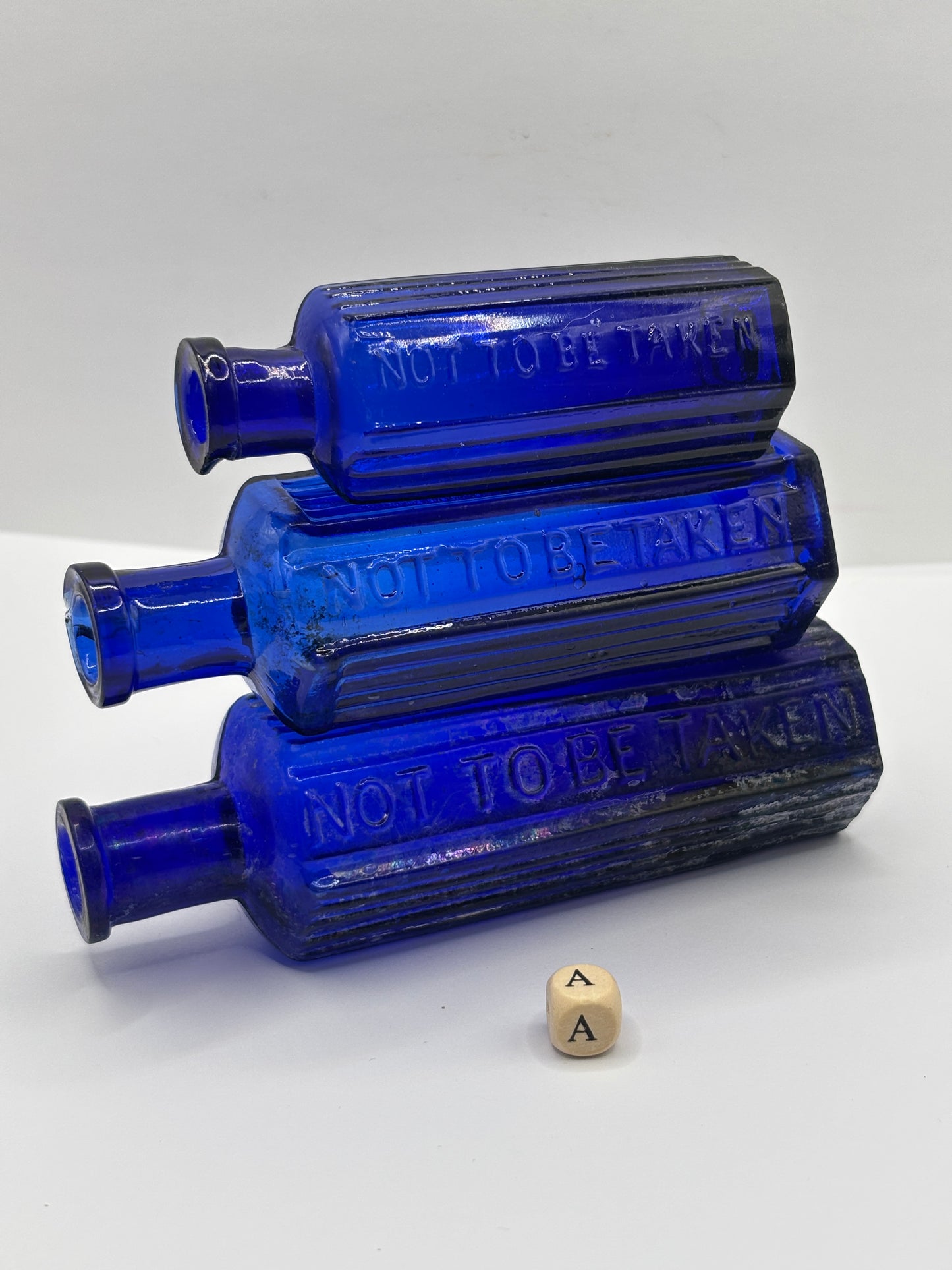 3 old blue glass poison bottles, chipped & crusty (a)