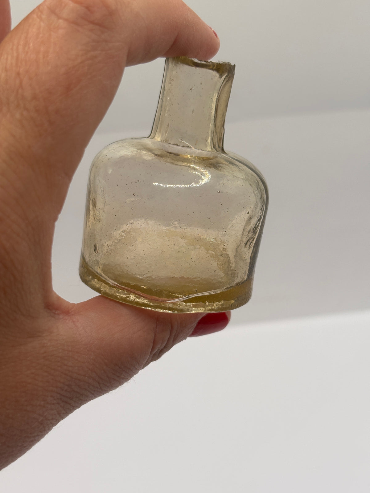 Old glass ink, inkwell, peachy coloured