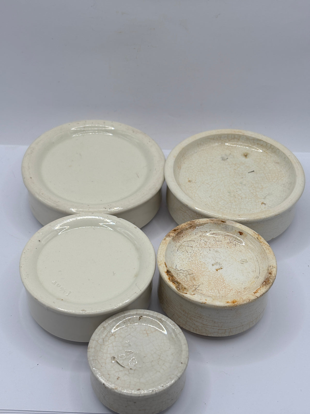 5 old stoneware pot lid bases, stackers (G)