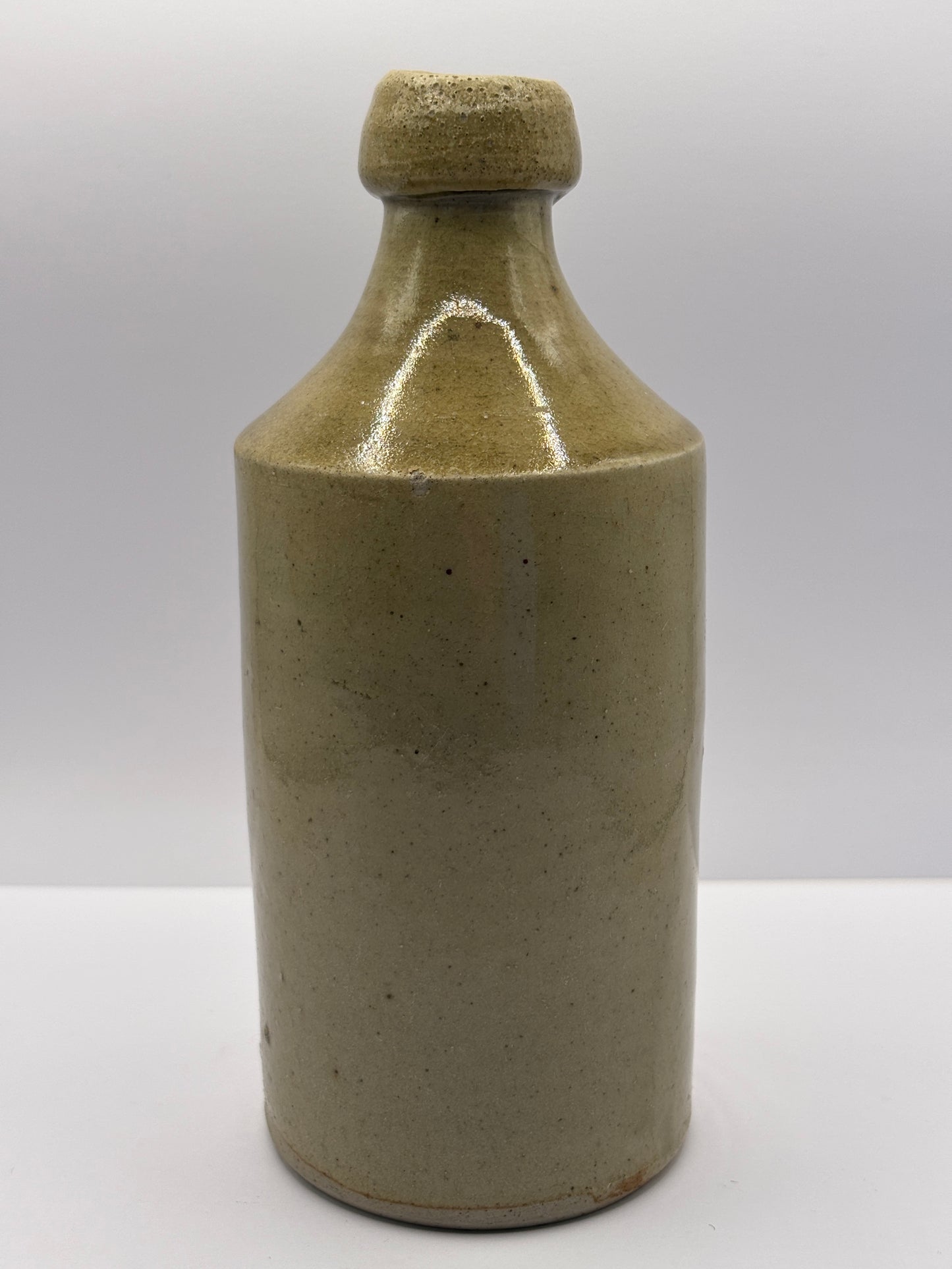 Early plain stoneware ginger beer bottle
