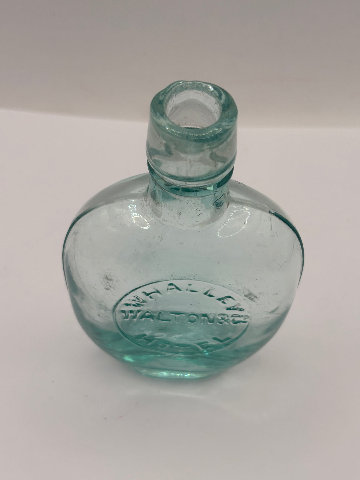 Old glass spirit flask, Whalley hotel
