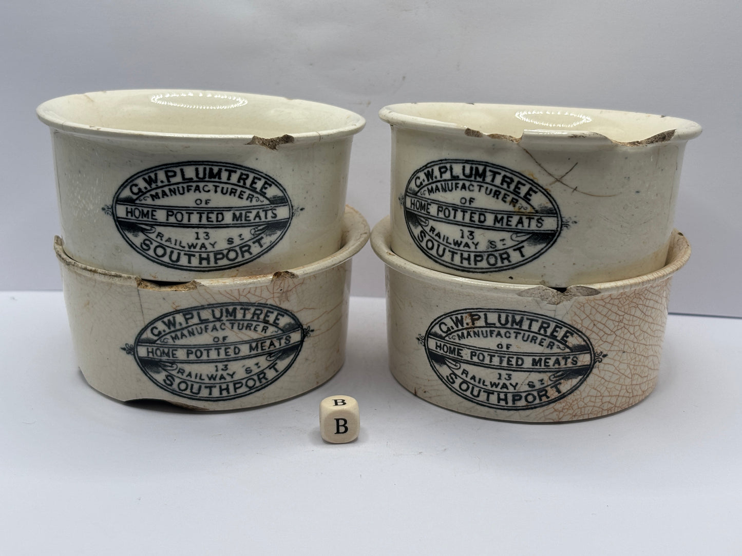 4 old advertising meat paste pots (B) damaged
