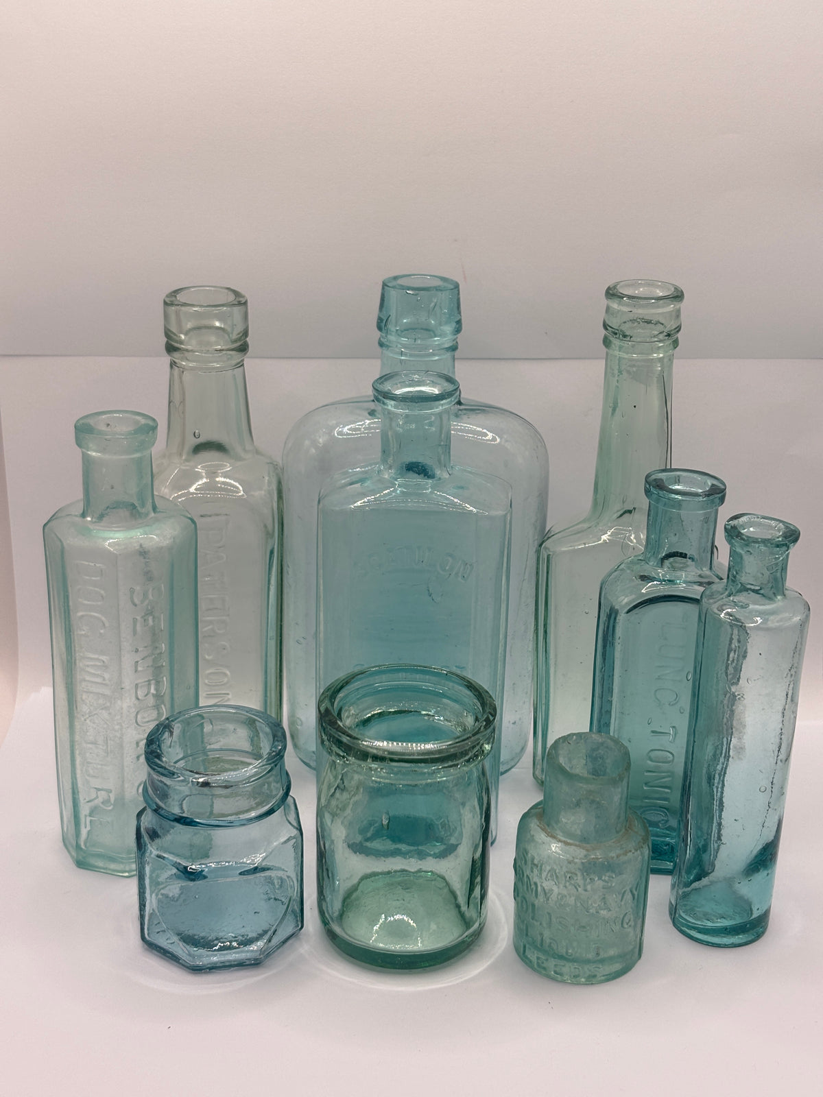 10 Old aqua glass chemist bottles