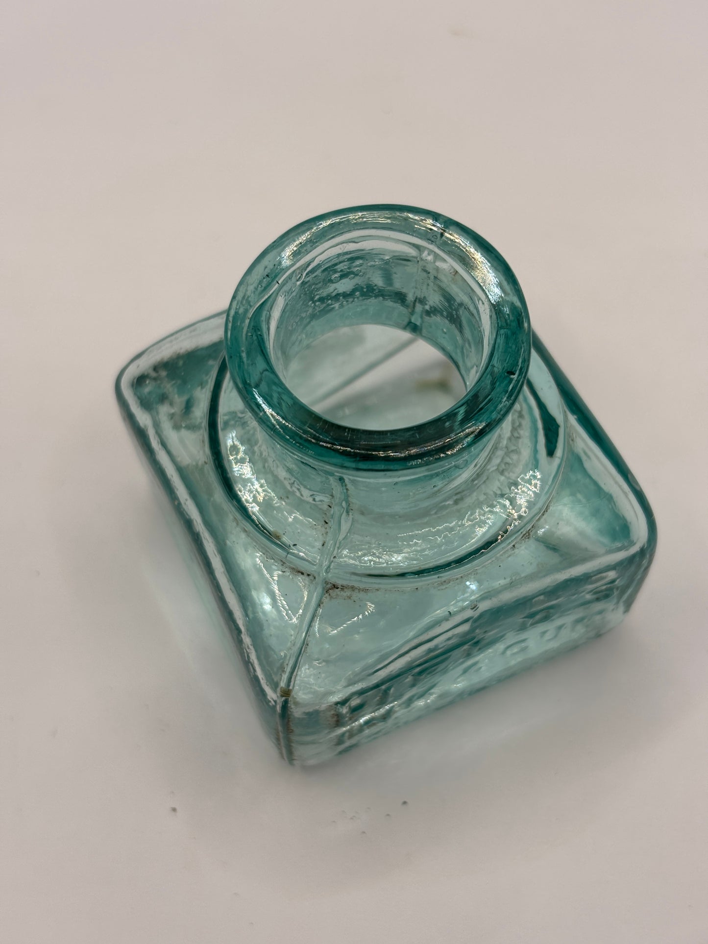 Old aqua glass advertising inkwell, ink bottle. Fields ink