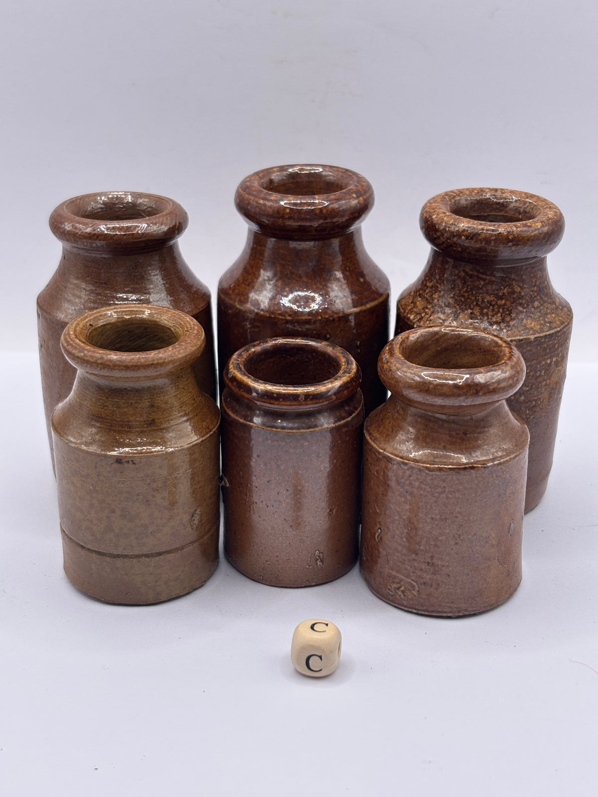 6 small brown stoneware pots (c)