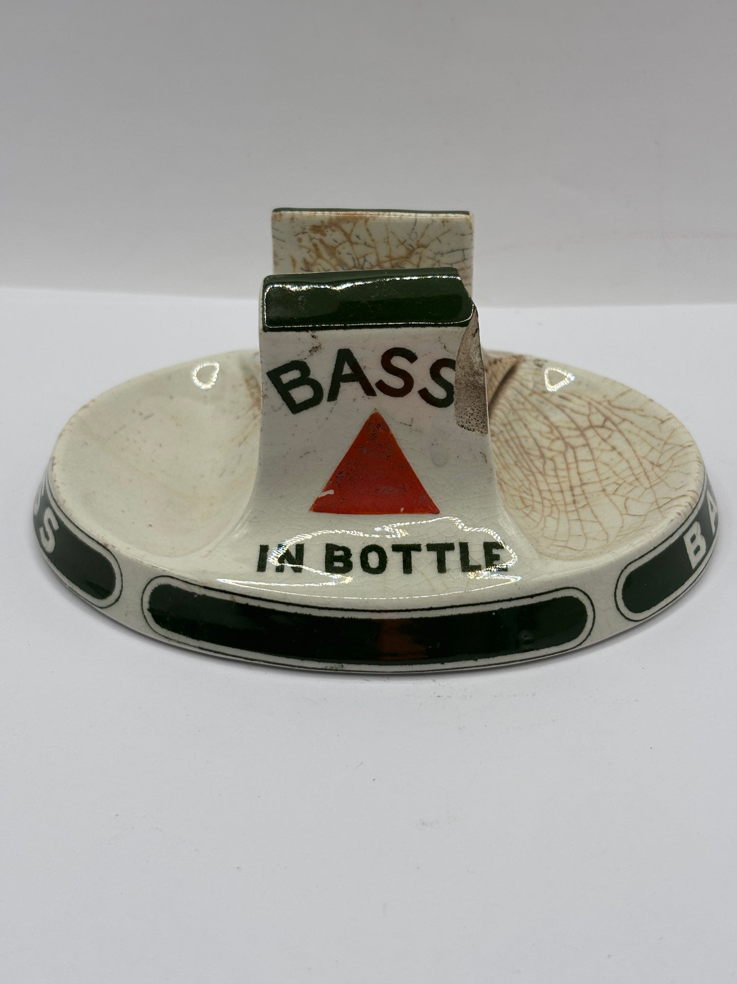 Old stoneware match striker. Bass bottled beer. Damages