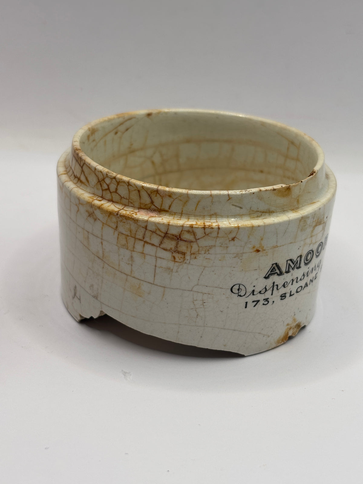 Old advertising base, amoore & Co dispensing chymists. Damaged