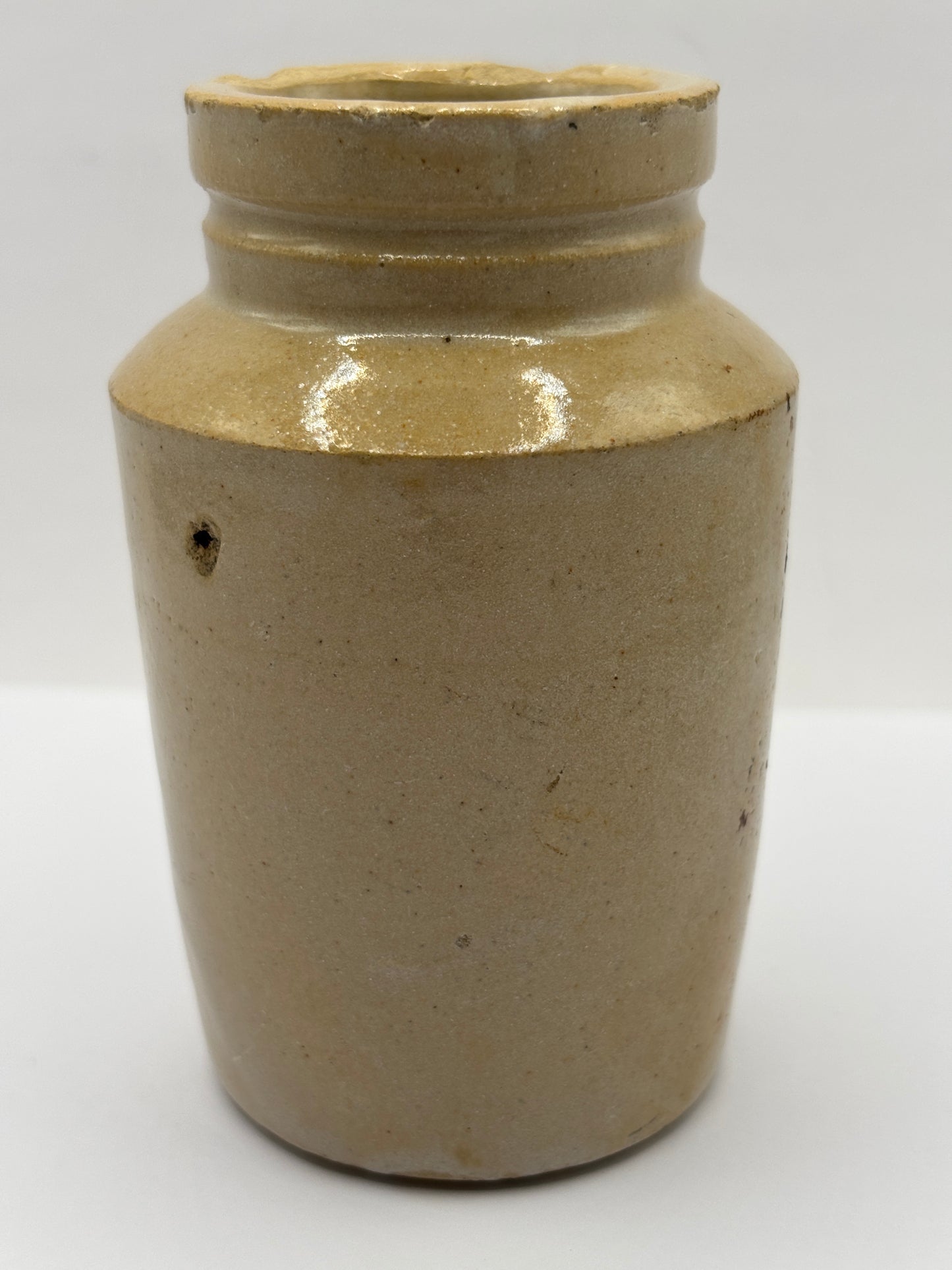 Old plain stoneware cream pot. Chipped