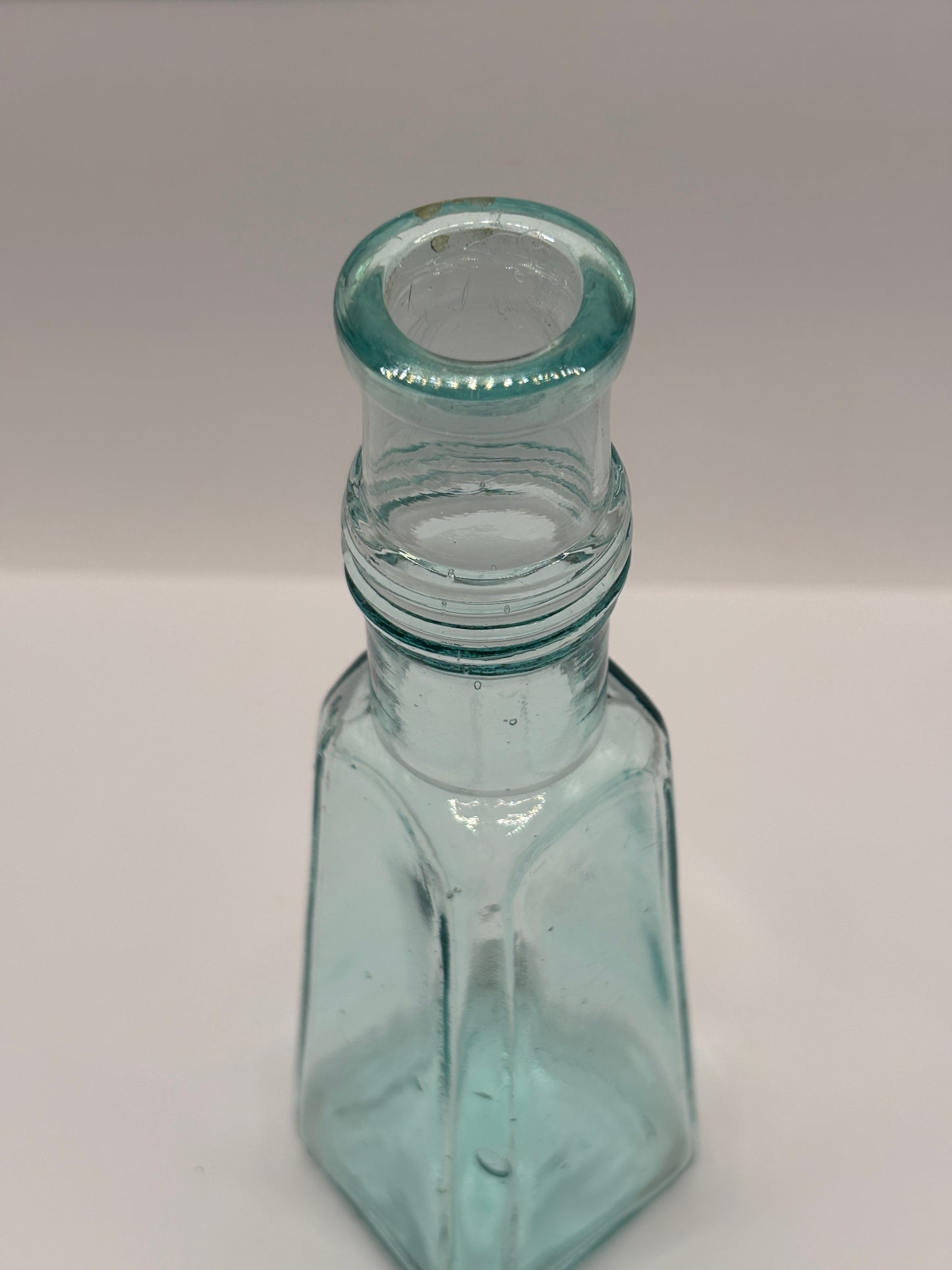 Old aqua glass sauce bottle