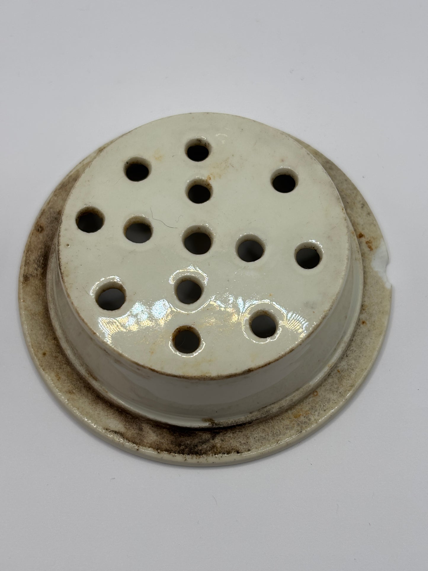 Old stoneware strainer
