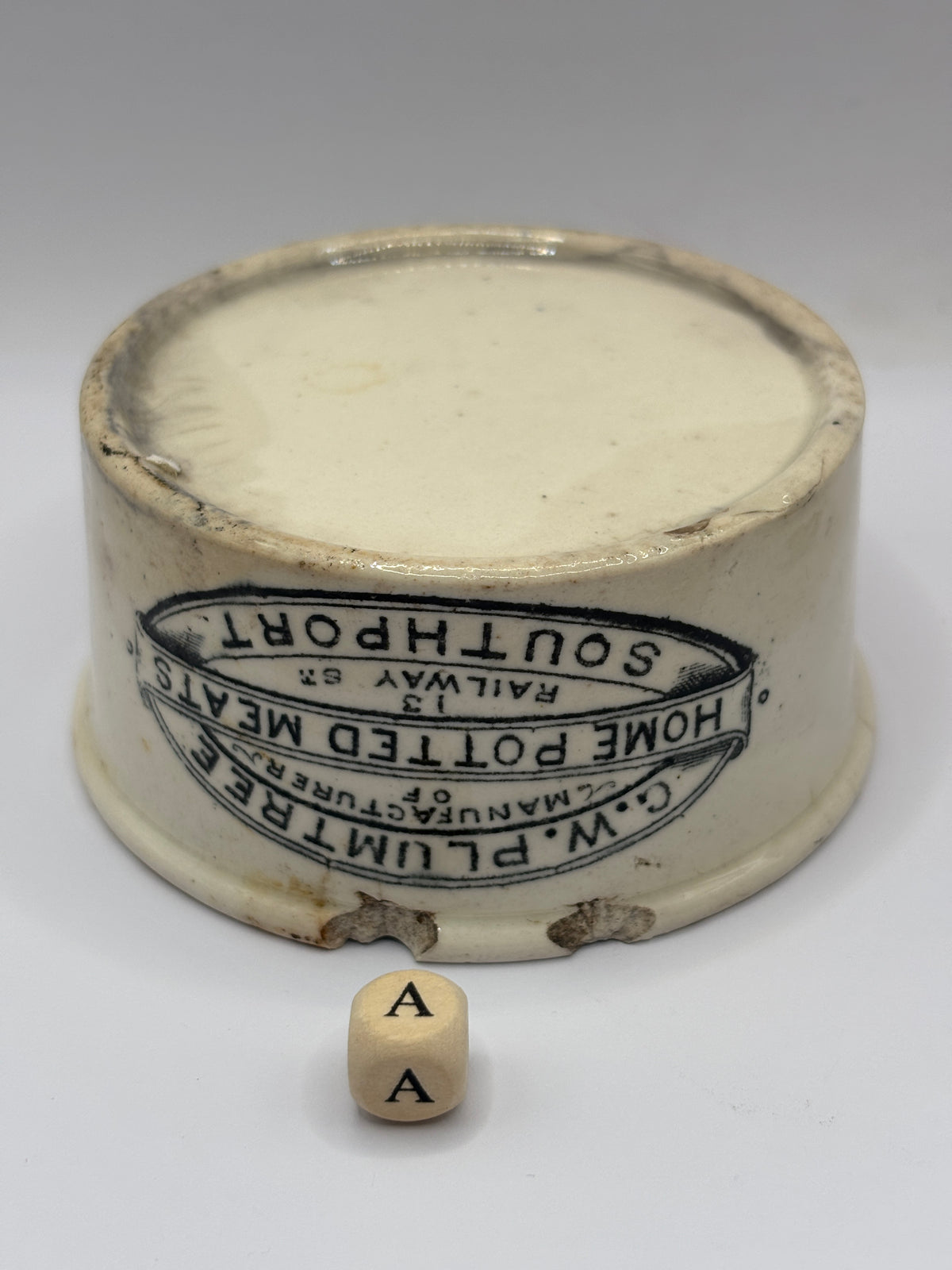 Old advertising meat paste pot, Plumtree home potted meats. Damaged (a)