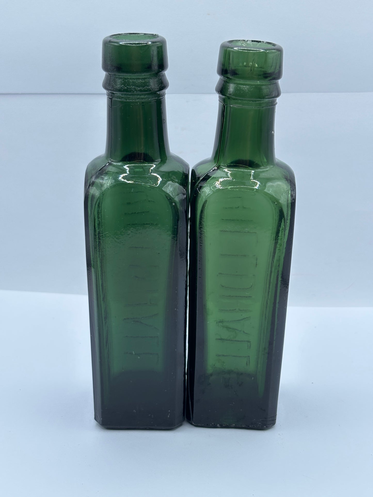 2 old green glass coffee essence bottles