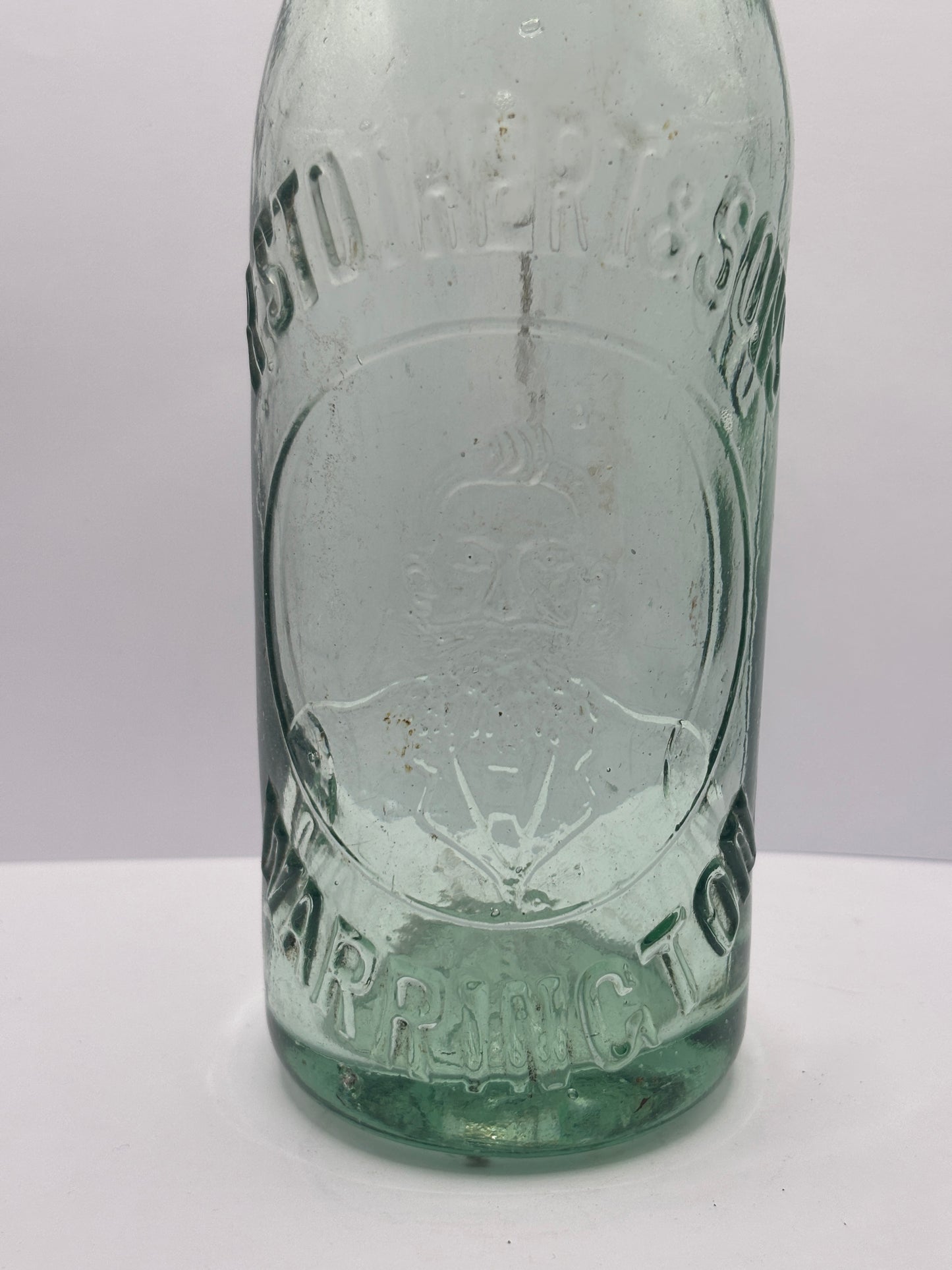 Old aqua glass Stotherts beer bottle