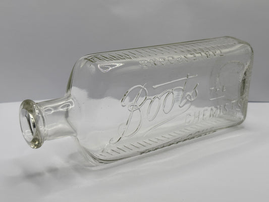 Old clear glass Boots chemist bottle