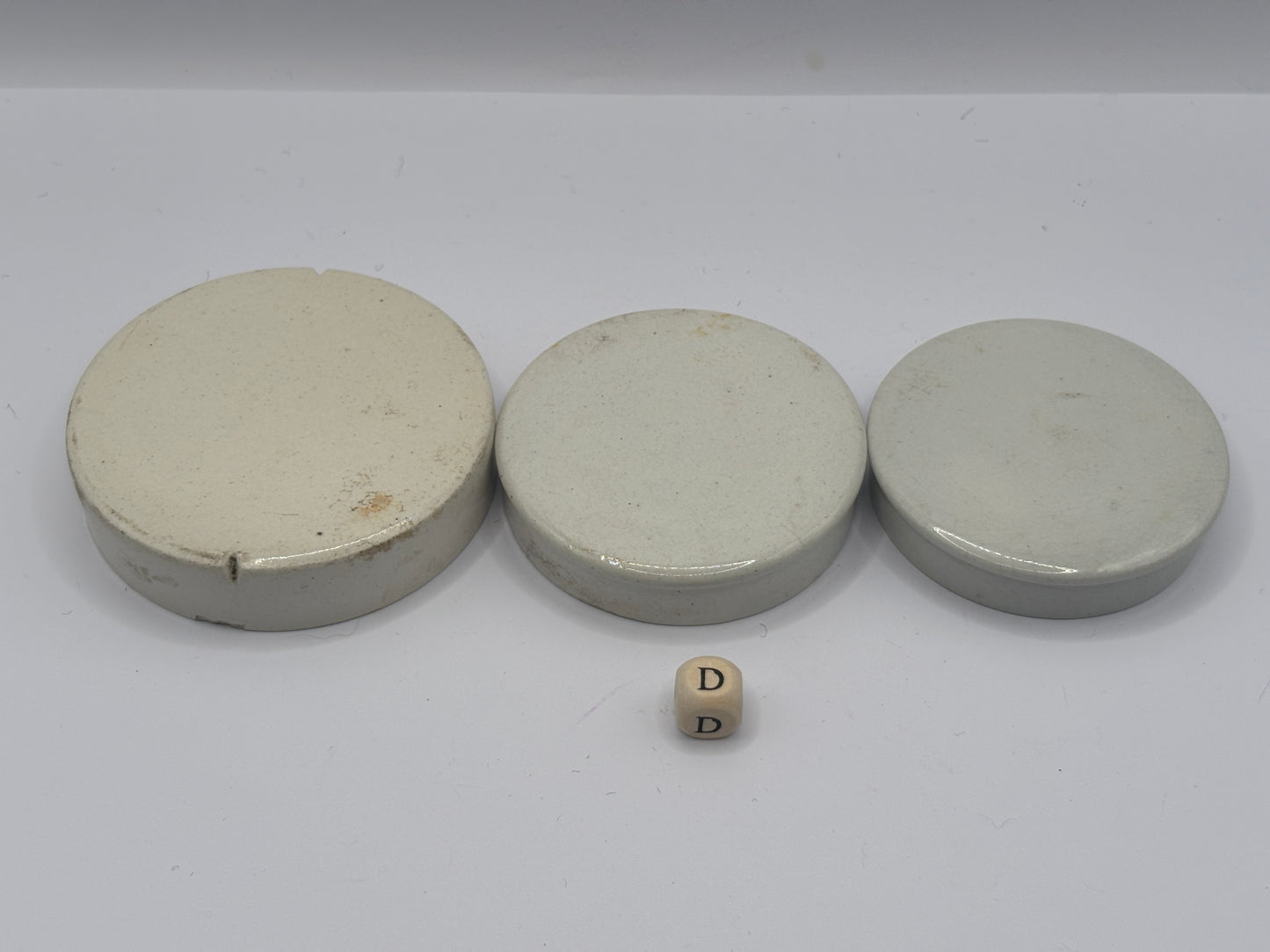 3 old plain stoneware lids (D)
