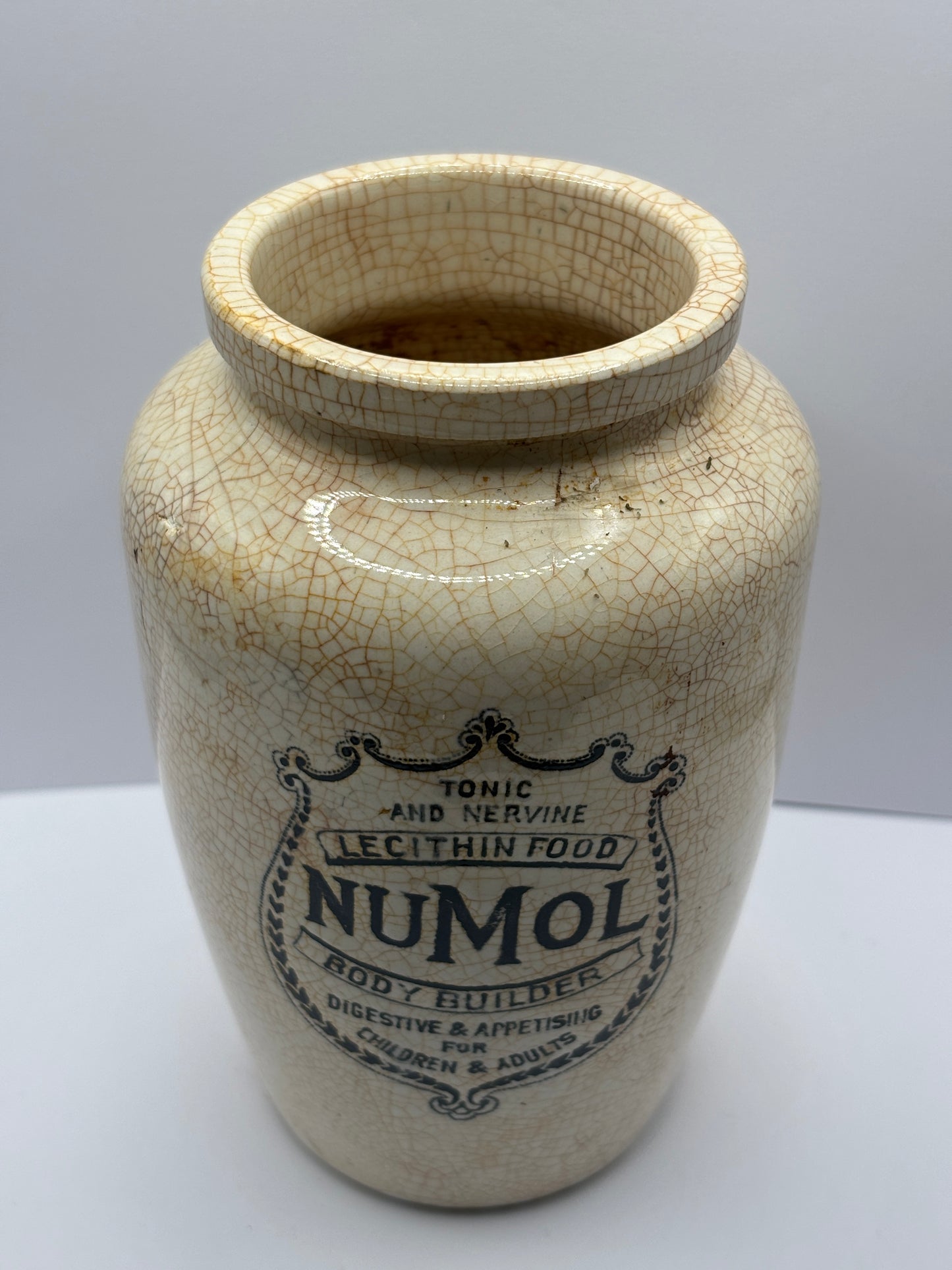 Old stained & crazed numol body builder advertising jar, 14cms