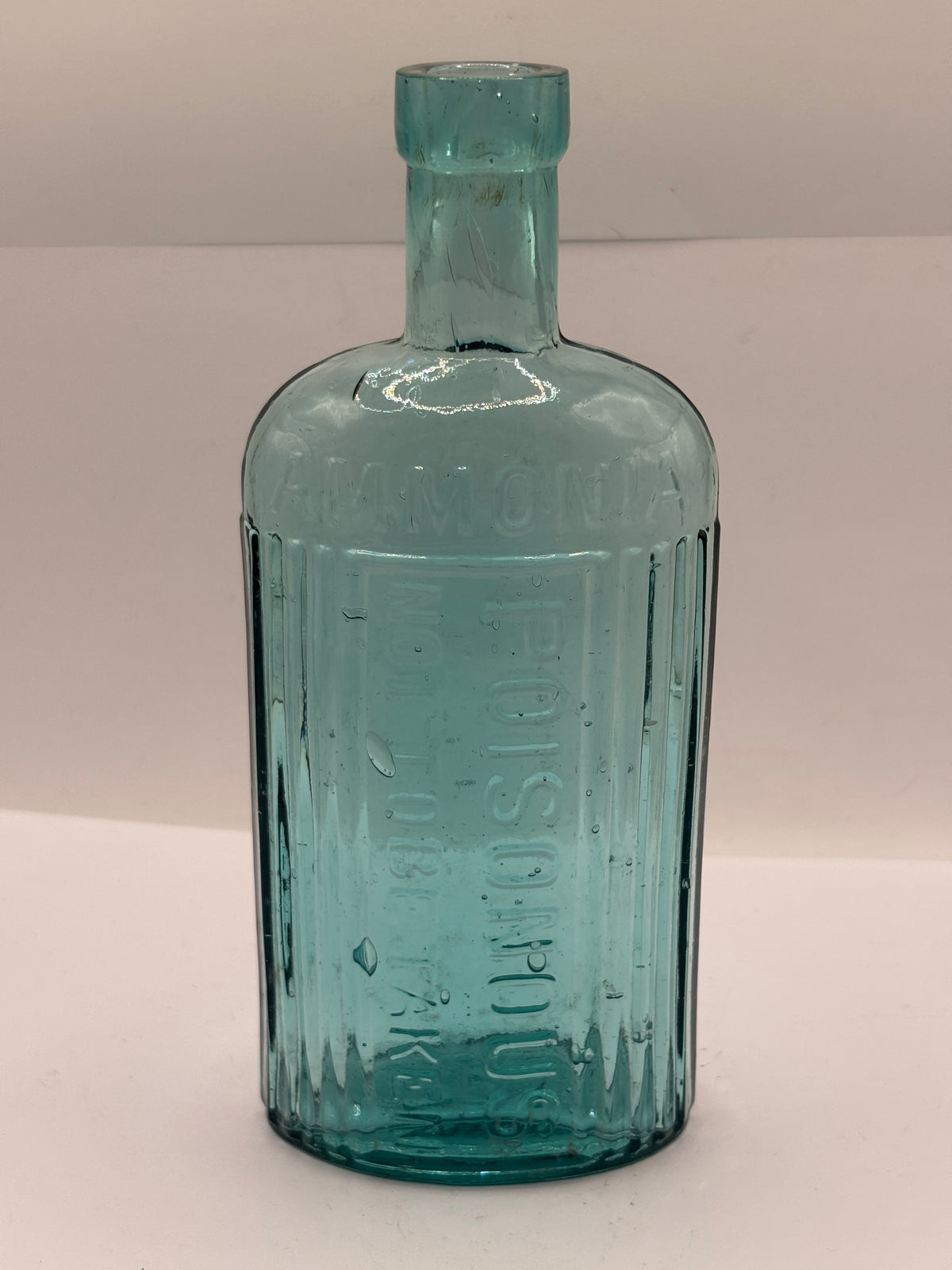 Old aqua glass poison bottle, ammonia, POISONOUS not to be taken