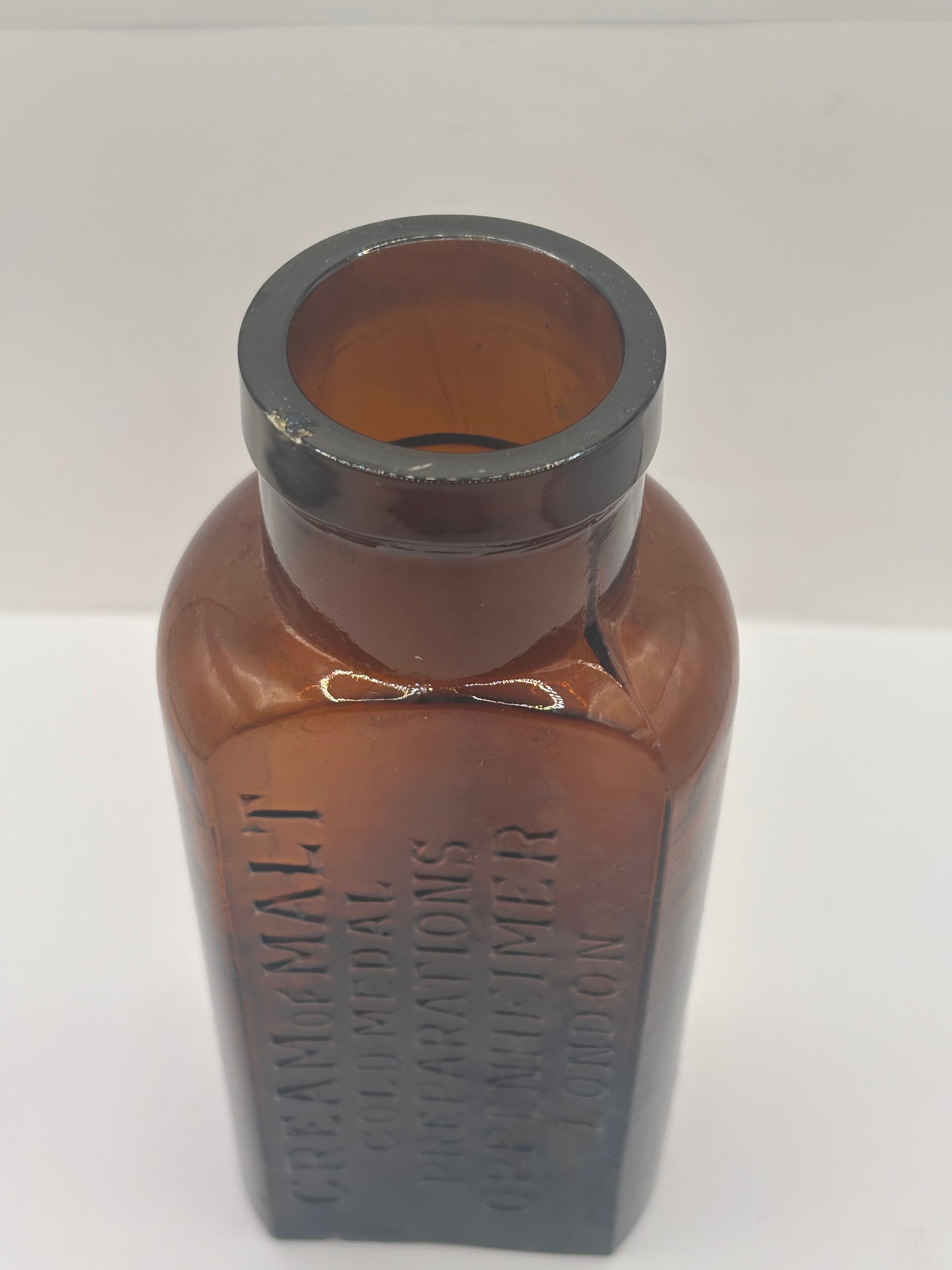 Old amber glass cream of malt bottle