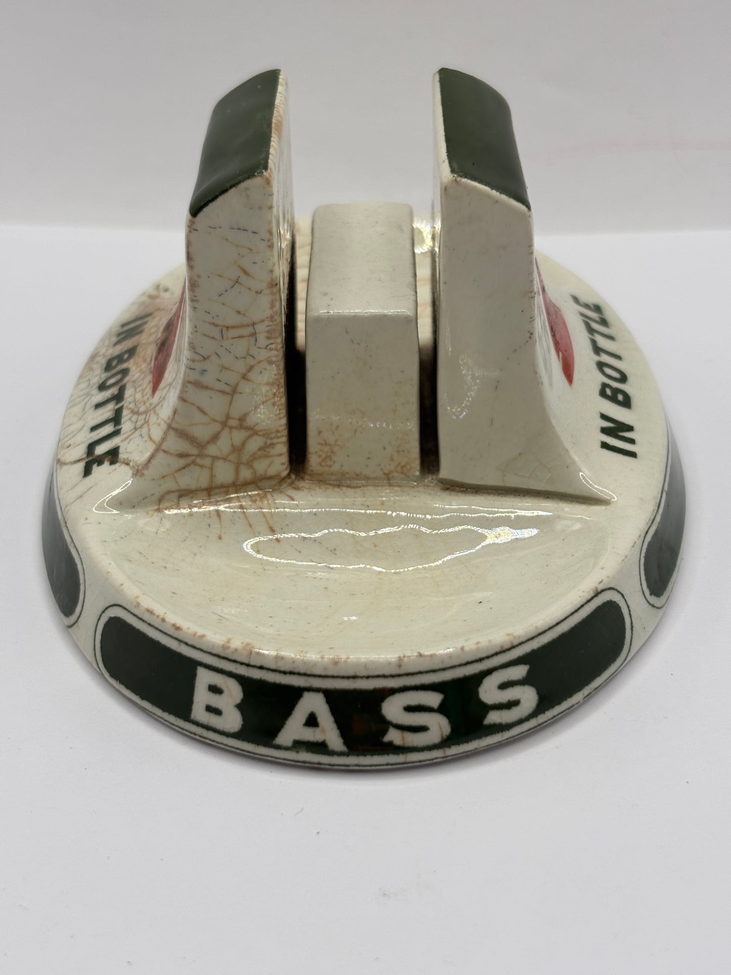 Old stoneware match striker. Bass bottled beer. Damages