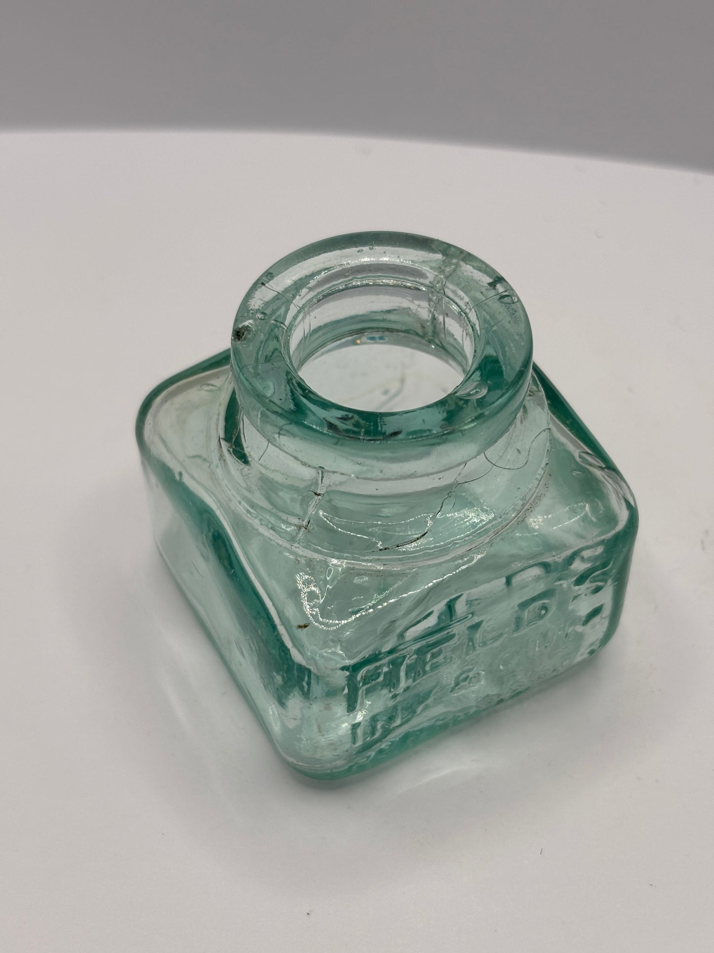 Old aqua glass ink bottle, inkwell. fields ink & gum