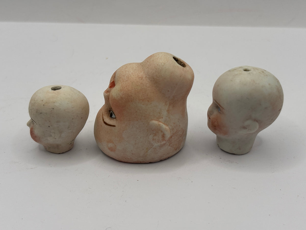 3 Old small bisque dolls heads