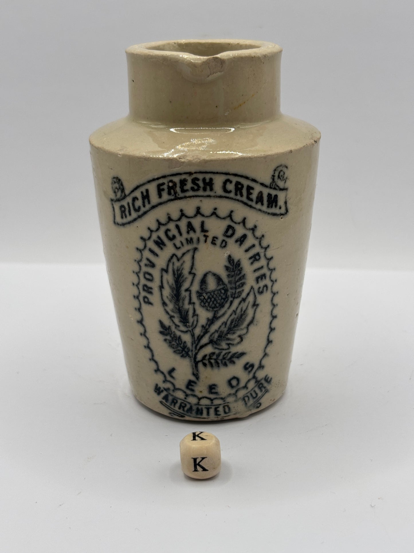 Old stoneware advertising cream pot. Provencial dairies Leeds (k) damaged