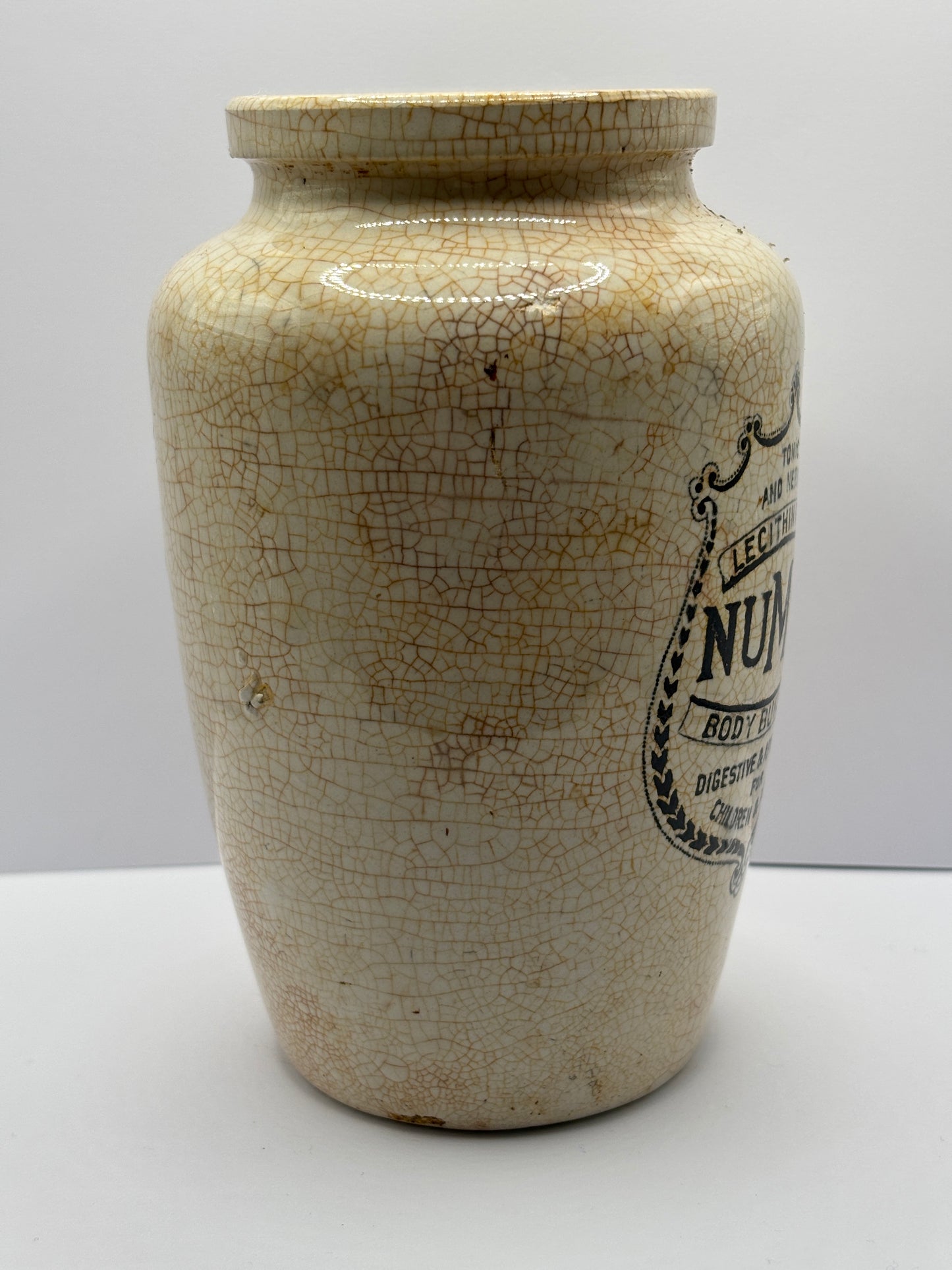 Old stained & crazed numol body builder advertising jar, 14cms