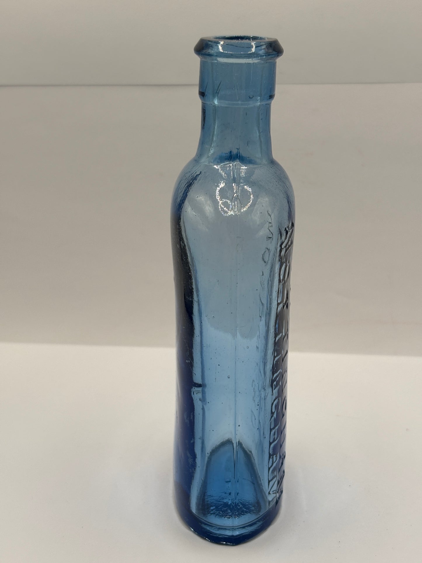 Old blue glass advertising chemist bottle, Woodwards Nottingham