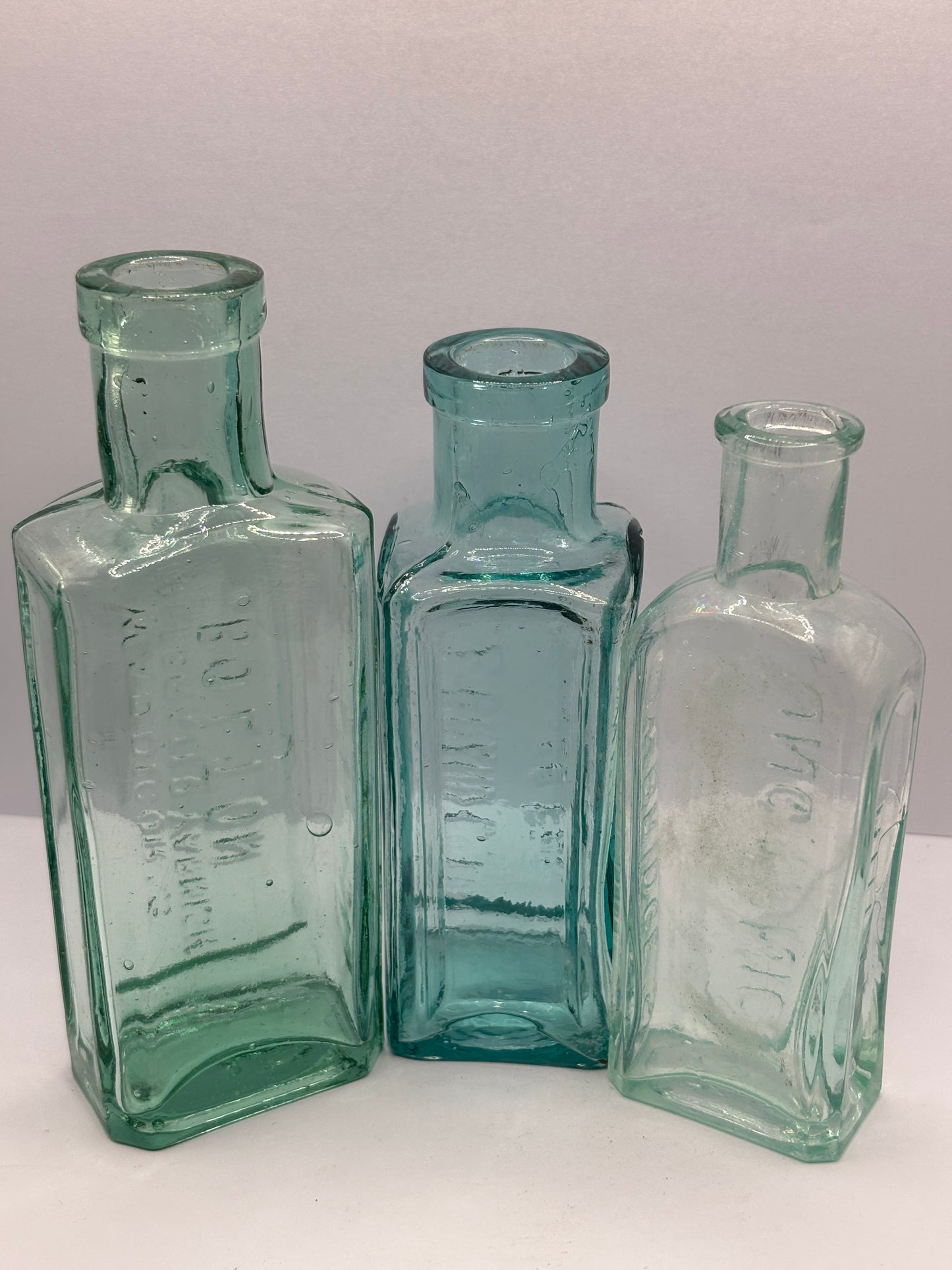 3 old aqua glass advertising chemist bottles